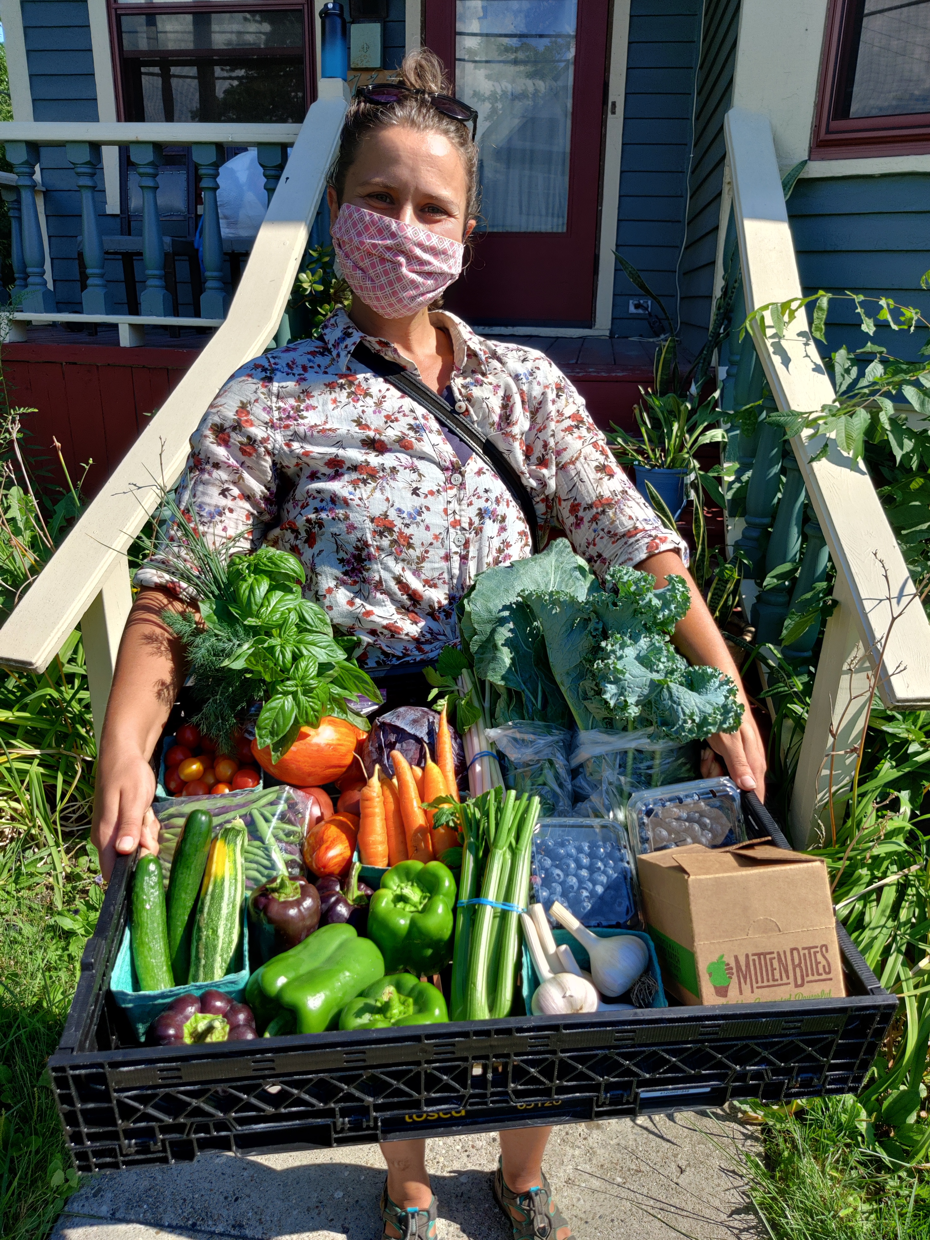 Heidi Bombrisk delivers a CSA box.